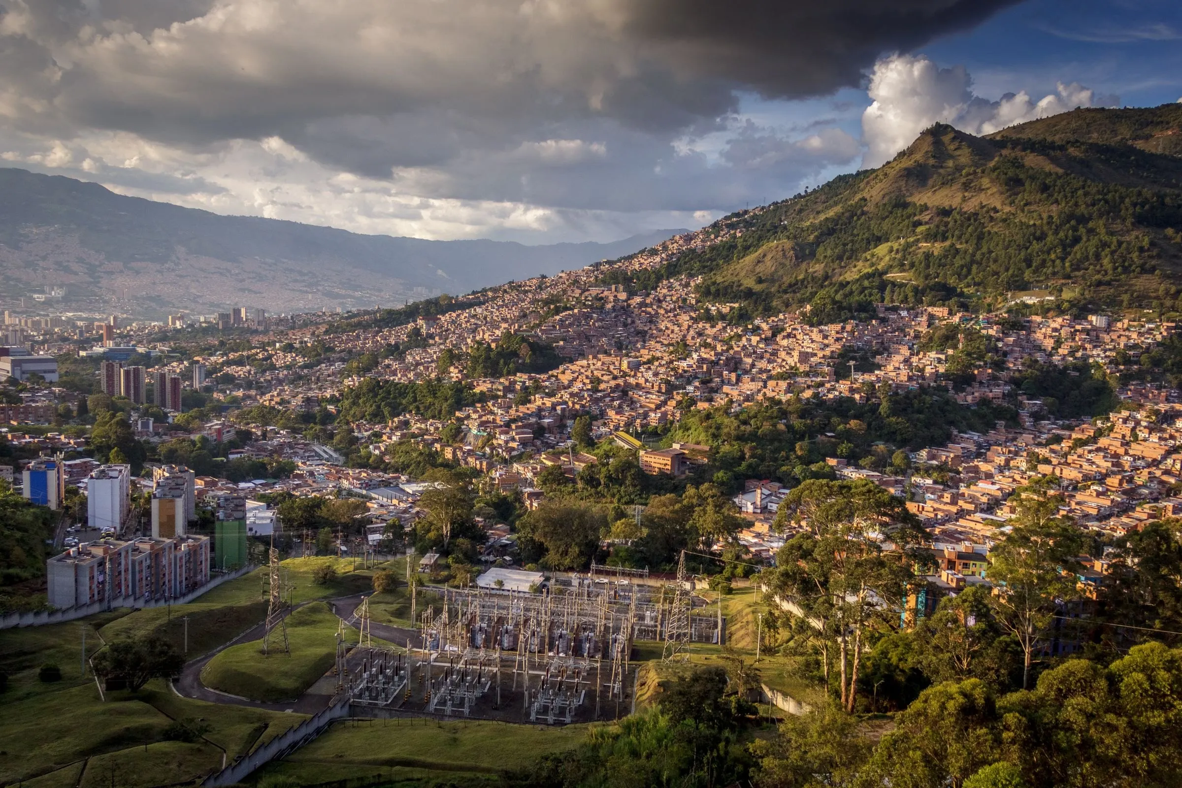 Medellín and its green hills under a dramatic sky